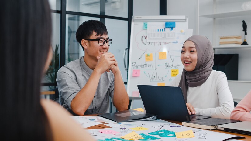 multiracial-group-young-creative-people-smart-casual-wear-discussing-business-brainstorming-meeting-ideas-mobile-application-software-design-project-modern-office_7861-3067